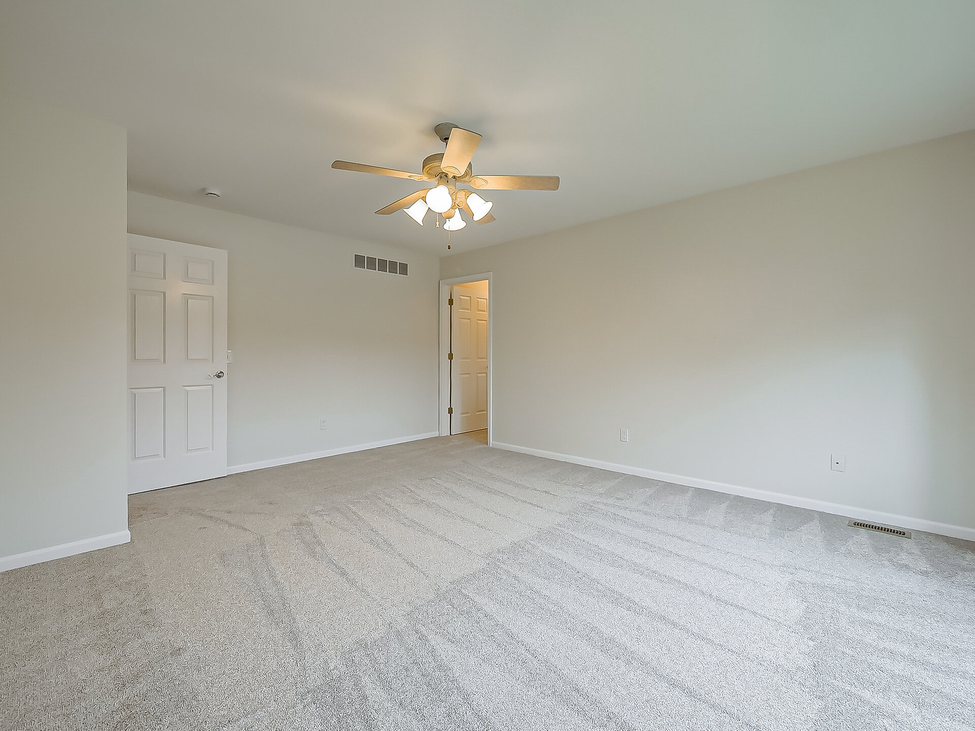 Primary bedroom from doorway before